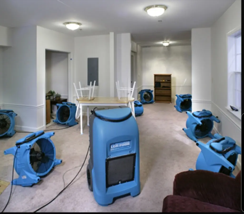 Air movers and dehumidifier setup for Water Damage Restoration in Handy